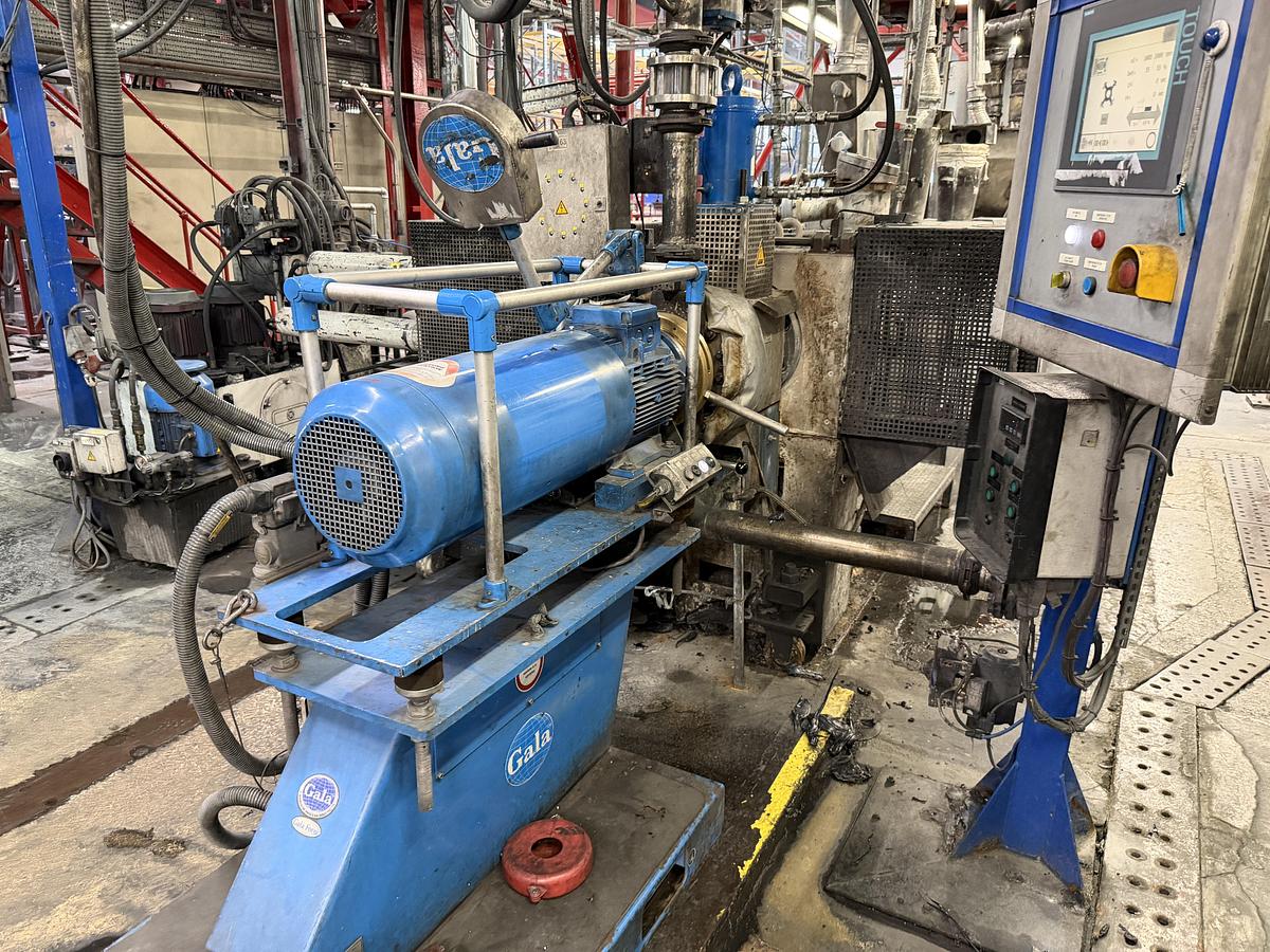 Used 110mm Berstorff model ZE110 A UT 44D twin screw compounding line. 600rpm screws. 1080kw motor. Brabender feeders. Gala EAC model 7