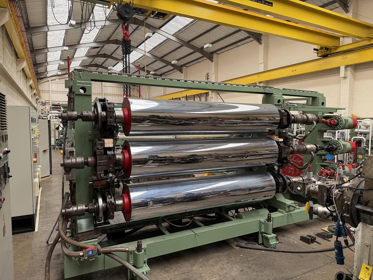 Used 2400mm wide Reifenhauser 3 roll polishing stack with thermoregulation, haul off. 2400mmx500mm individual drives. Variable speed haul off. In line knives.