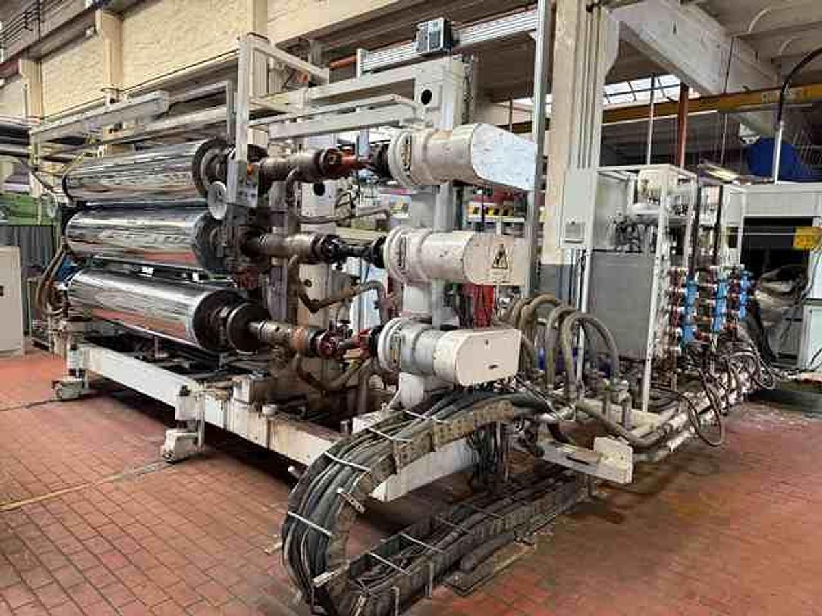 Used 2400mm wide Reifenhauser 3 roll polishing stack with thermoregulation, haul off. 2400mmx500mm individual drives. Variable speed haul off. In line knives.