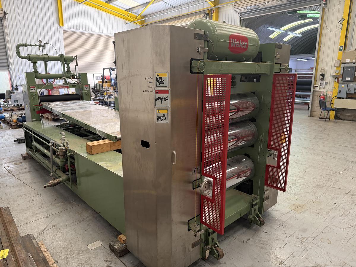 Used 890mm x 300mm Welex 3 roll polishing stack with pump group, and haul off. Silent chain driven rolls, pneumatic nip, 97