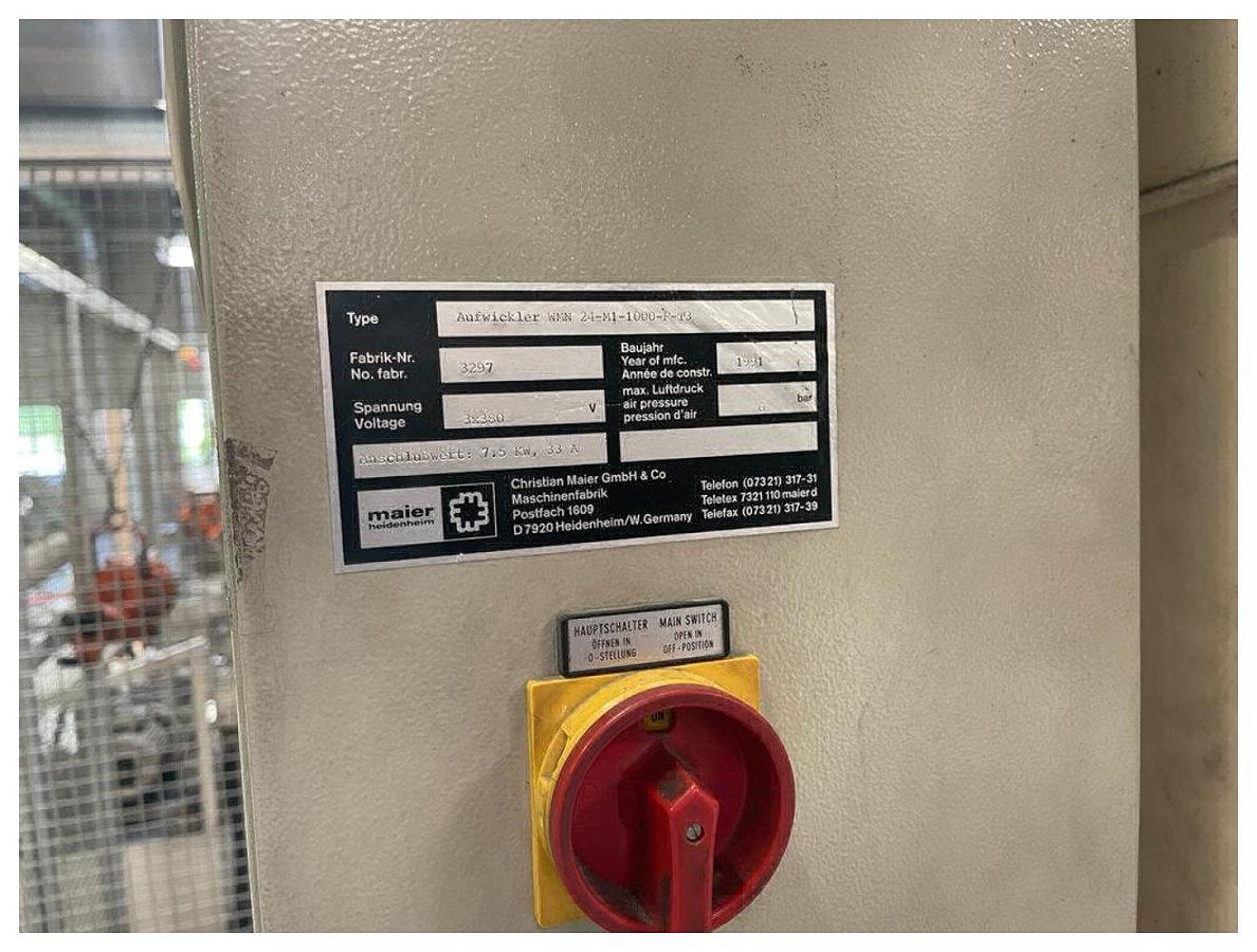 Used 1000mm wide Maier 2 station auto splice winder with overhead frame. Model WMN 24-M1-1000-F-T3 Max diameter 1000mm. Accumulator. 1991
