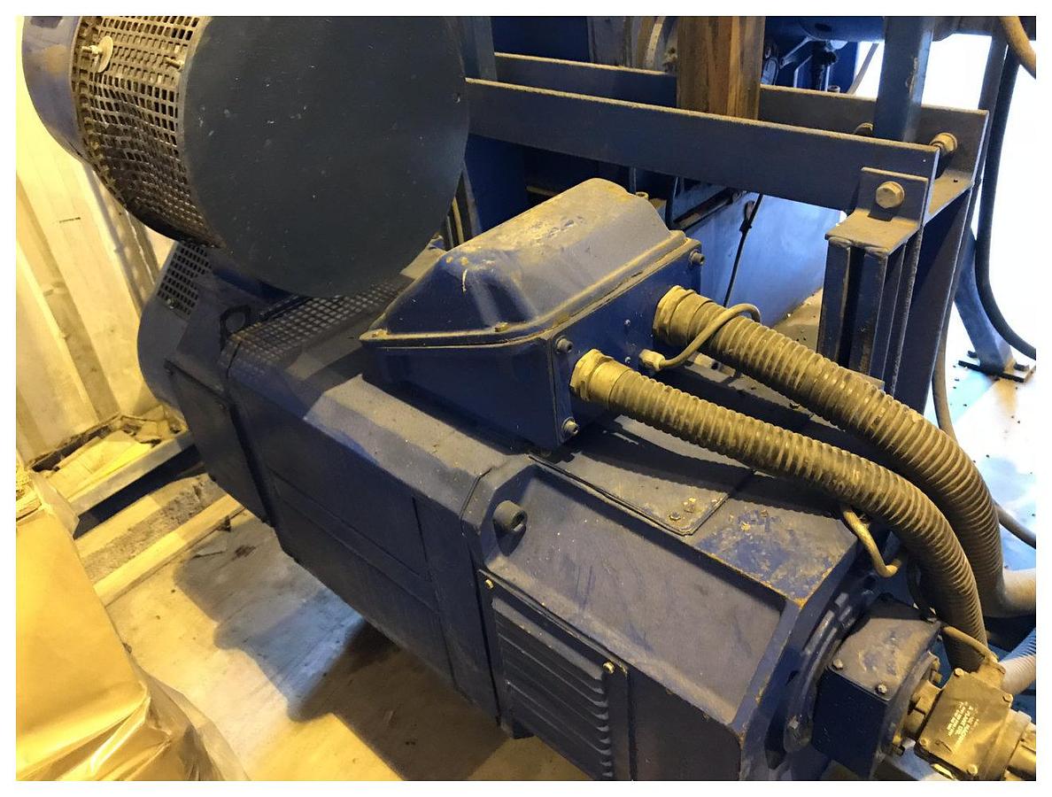 Used 90mm Dolci single screw extruder, 33D, with plugged vent. DC motor, approx 90kw. Electrically heated, fan cooled barrel. 20 zone temperature control panel