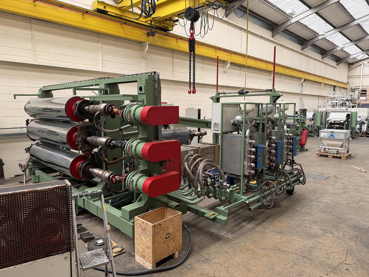 Used 2400mm wide Reifenhauser 3 roll polishing stack with thermoregulation, haul off. 2400mmx500mm individual drives. Variable speed haul off. In line knives.