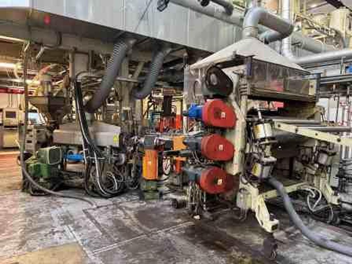 Used 1350mm wide Omipa coextrusion sheet line with 120mm 90mm 60mm extruders, feedblock,  1300mm x 400mm calender, pump group haul off, Guillotine. 1999