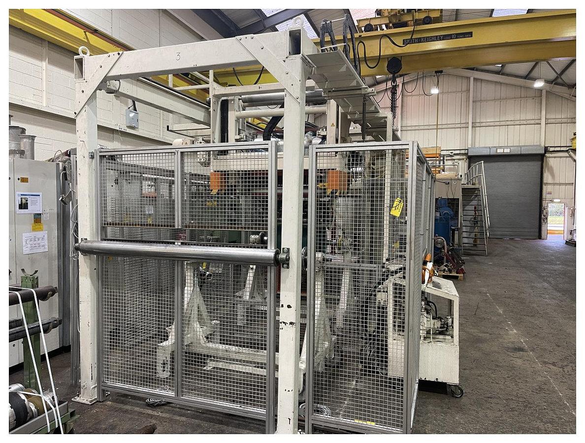 Used 1000mm wide Maier 2 station auto splice winder with overhead frame. Model WMN 24-M1-1000-F-T3 Max diameter 1000mm. Accumulator. 1991