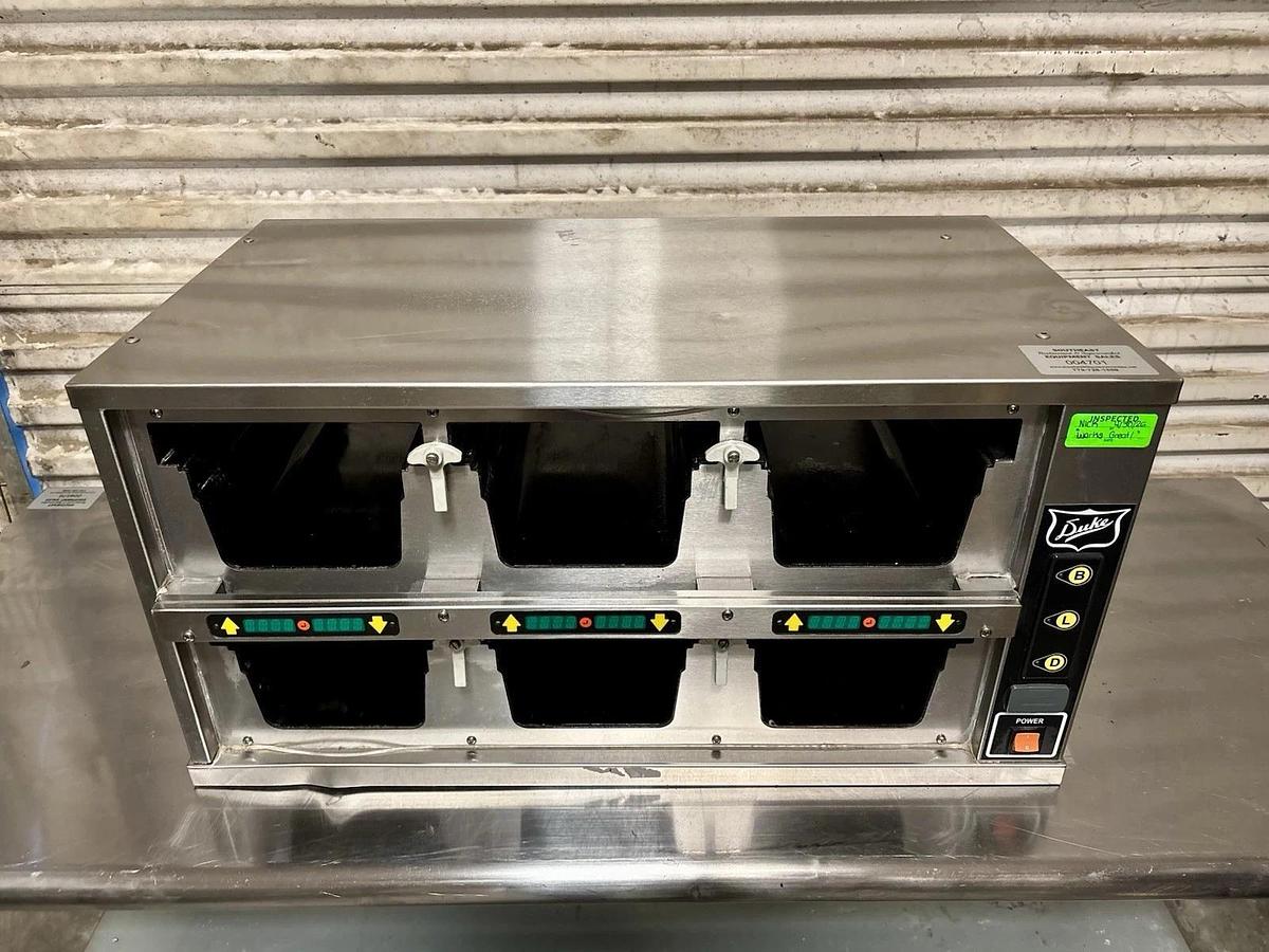 Used Duke FWM34-23-120 Dual-Sided, 6 Pan Visual Pass-Thru Food Warmer Holding Cabinet