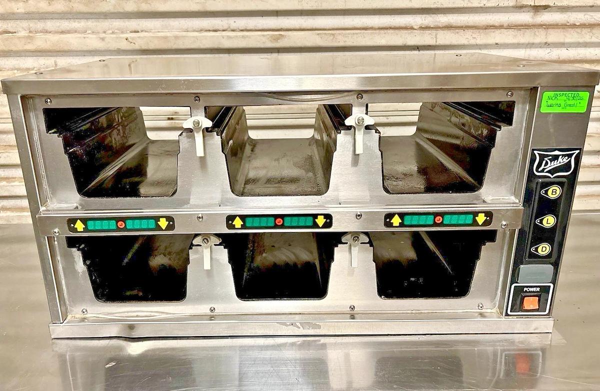 Used Duke FWM34-23-120 Dual-Sided, 6 Pan Visual Pass-Thru Food Warmer Holding Cabinet