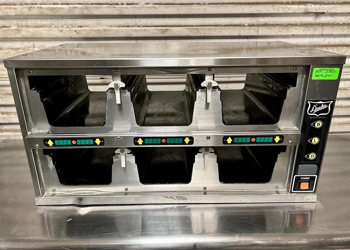 Used Duke FWM34-23-120 Dual-Sided, 6 Pan Visual Pass-Thru Food Warmer Holding Cabinet