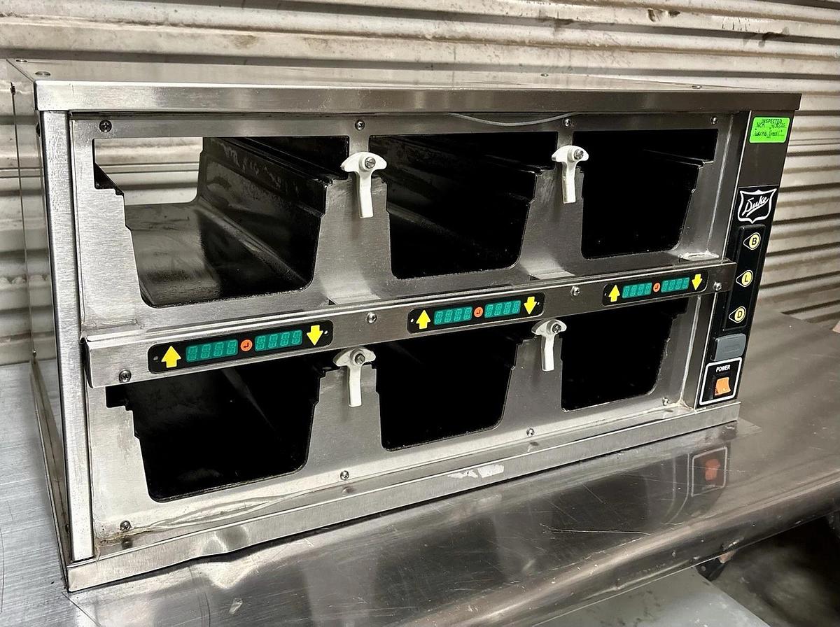 Used Duke FWM34-23-120 Dual-Sided, 6 Pan Visual Pass-Thru Food Warmer Holding Cabinet