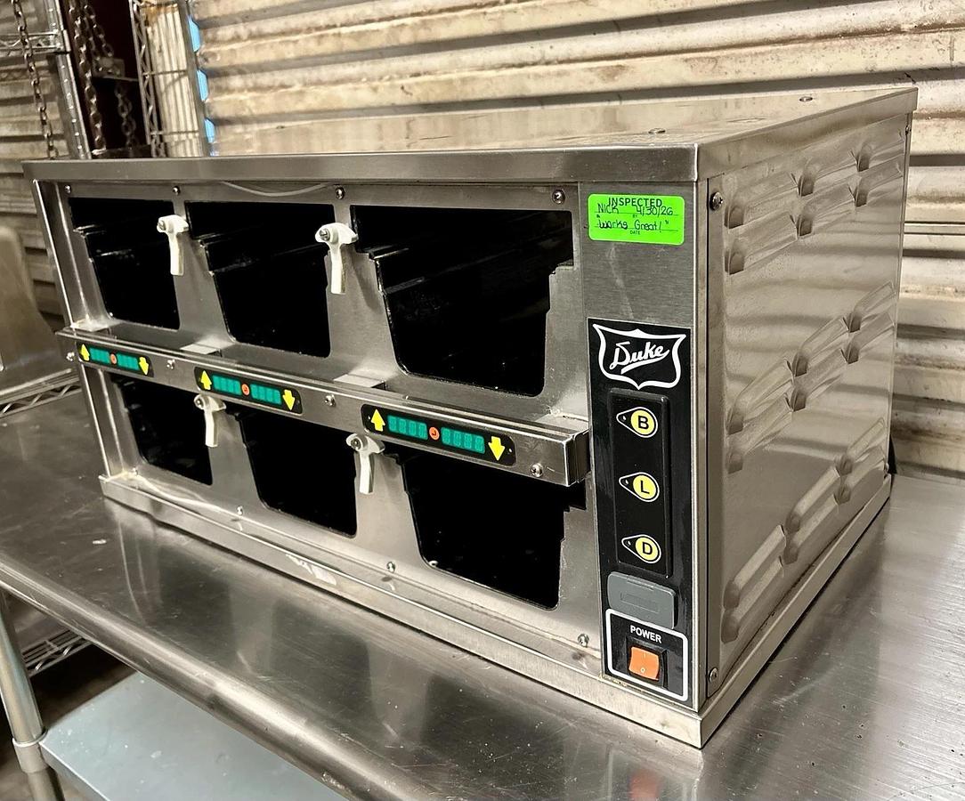 Used Duke FWM34-23-120 Dual-Sided, 6 Pan Visual Pass-Thru Food Warmer Holding Cabinet