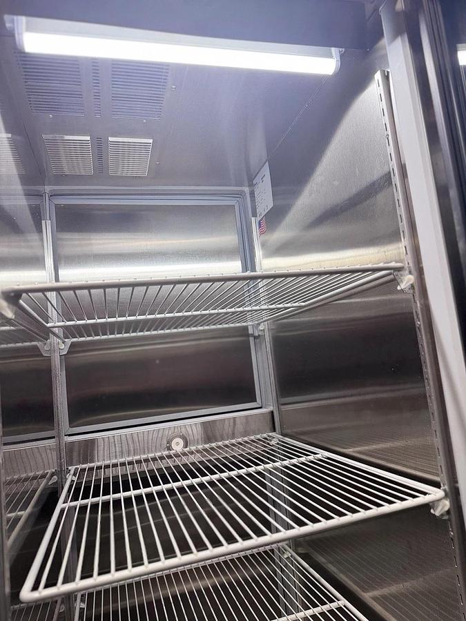 Used Norlake PR243SSG Stainless Steel Reach-In Refrigerator w/ Pass-Thru Doors, 1-Glass, 1-Solid Door