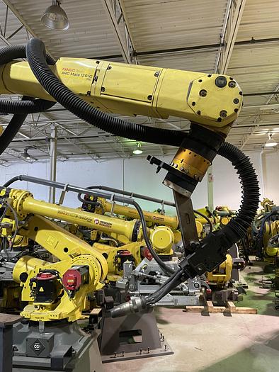 Used FANUC ARCMATE 120iC/10L MIG WELDING CELL WITH 2 AXIS 10' LONG DROP CENTER TRUNNION W/ROTARY CNC TABLE