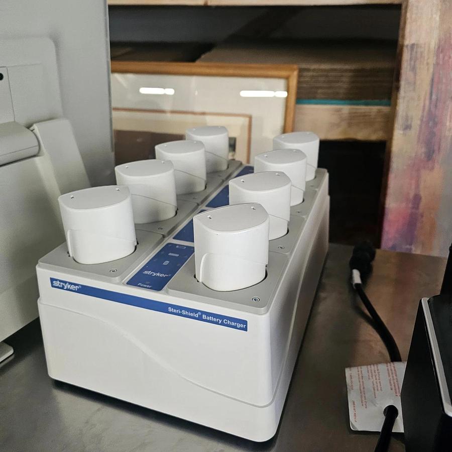 Used Stryker System T8 Personal Protection Battery Charger + 8 Batteries