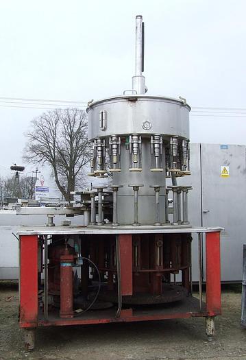 Used Automatic, vacuum carousel filler for liquids in bottles