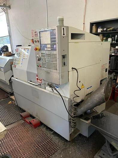 Used 2007 Haas CNC Lathe SL-10T & Servo Bar 300 Feeder