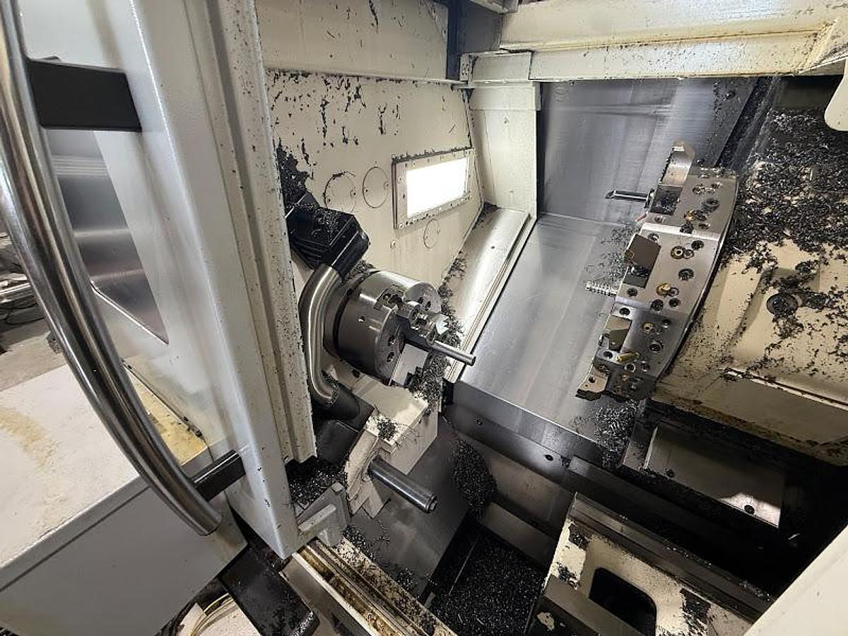 Used 2018 Okuma GENOS L250II-e Lathe w/ Bar Feeder and Conveyor