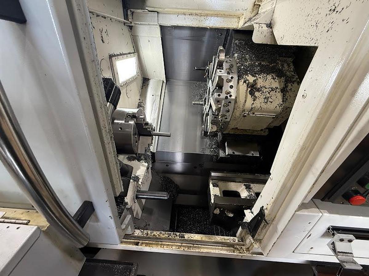 Used 2018 Okuma GENOS L250II-e Lathe w/ Bar Feeder and Conveyor