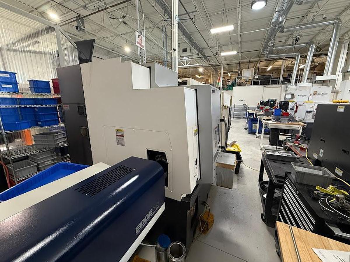 Used 2020 Okuma GENOS L300-MYW Lathe w/ Bar Feeder and Conveyor