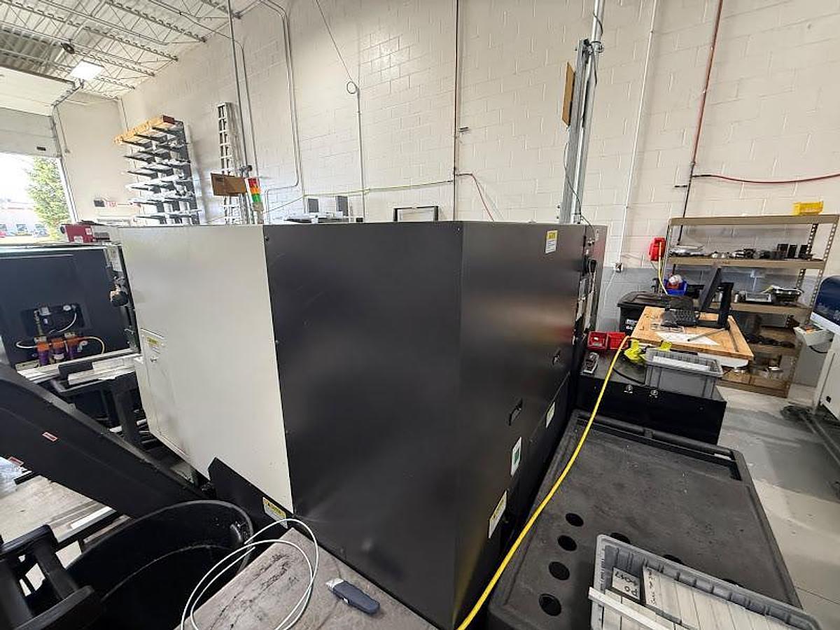 Used 2018 Okuma GENOS L300-M-e Lathe w/ Bar Feeder and Conveyor