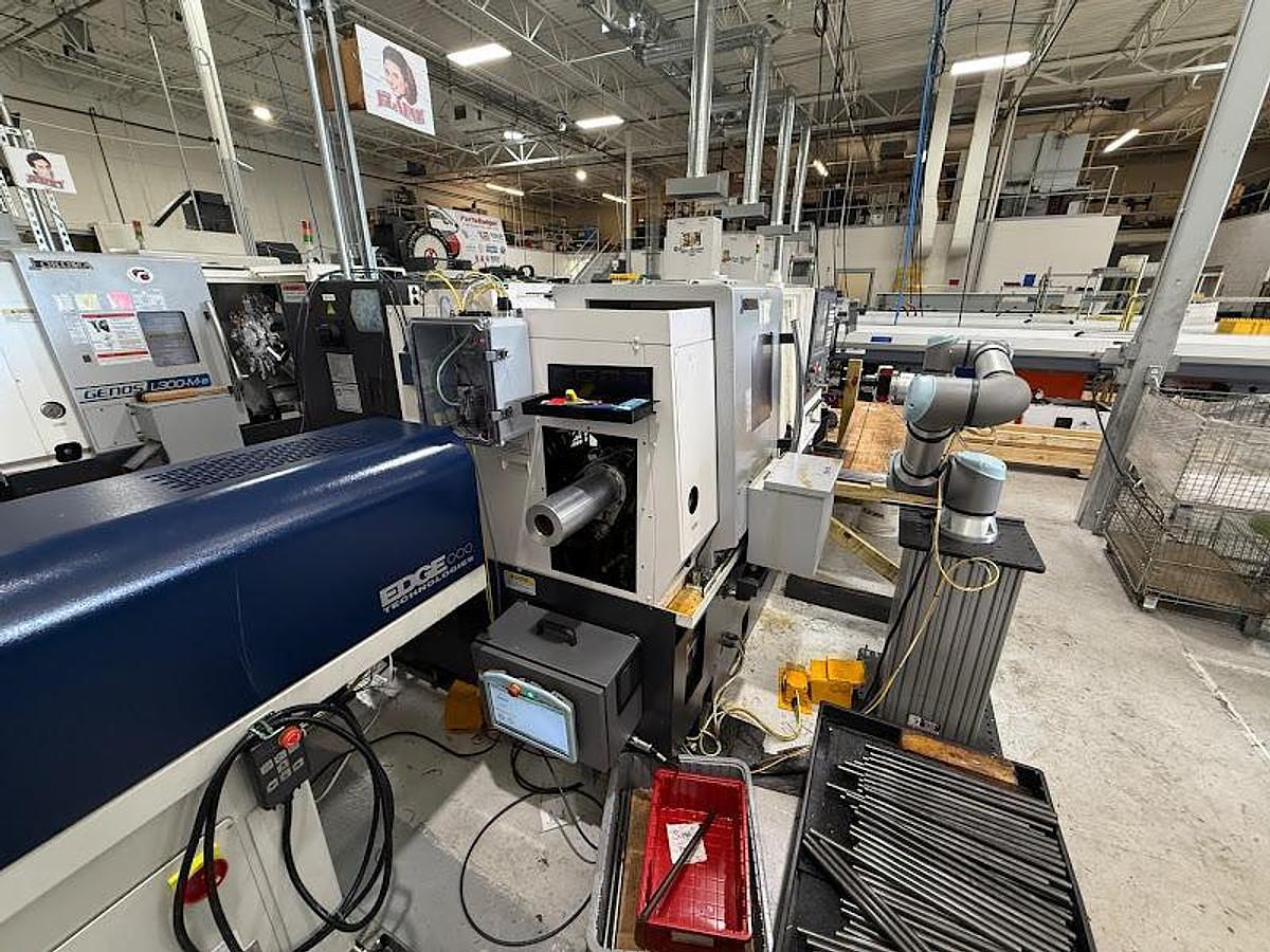 Used 2018 Okuma GENOS L250II-e Lathe w/ Bar Feeder and Conveyor