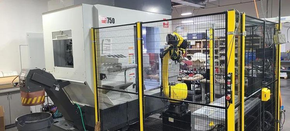 Used NOT READY - HAAS UMC-750 With FANUC M-20i D25 Robot Loading / Unloading system