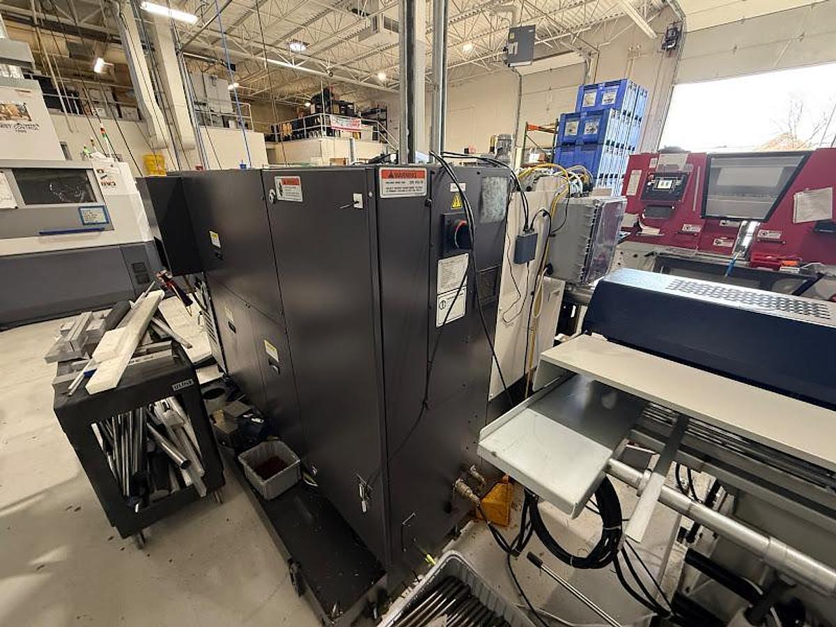 Used 2018 Okuma GENOS L250II-e Lathe w/ Bar Feeder and Conveyor