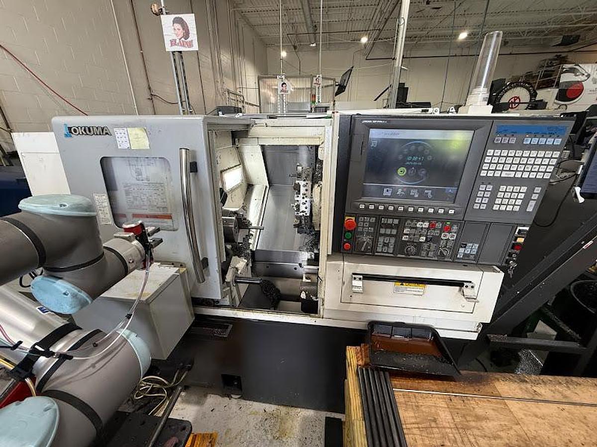 Used 2018 Okuma GENOS L250II-e Lathe w/ Bar Feeder and Conveyor