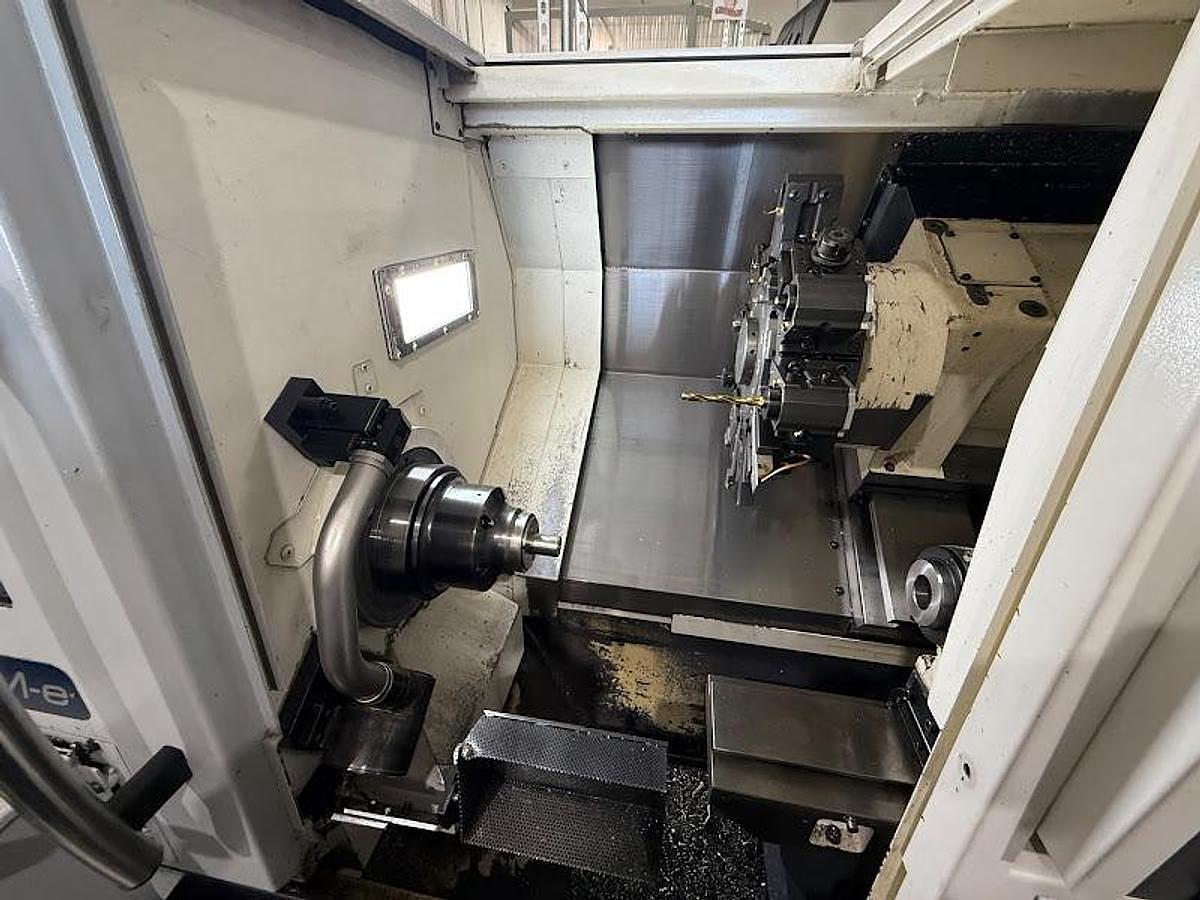 Used 2018 Okuma GENOS L300-M-e Lathe w/ Bar Feeder and Conveyor