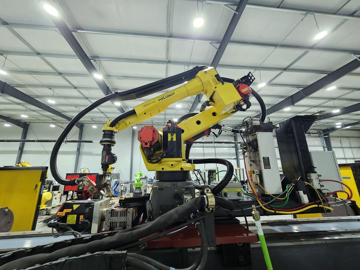Used FANUC Robotic Welding Cell W/ FANUC 120ic/R-30ib Tracks and Safety