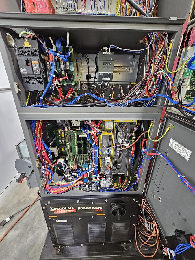 Used Lincoln system 35 weld cell Fanuc 120iC/10L with dual headstock positioners