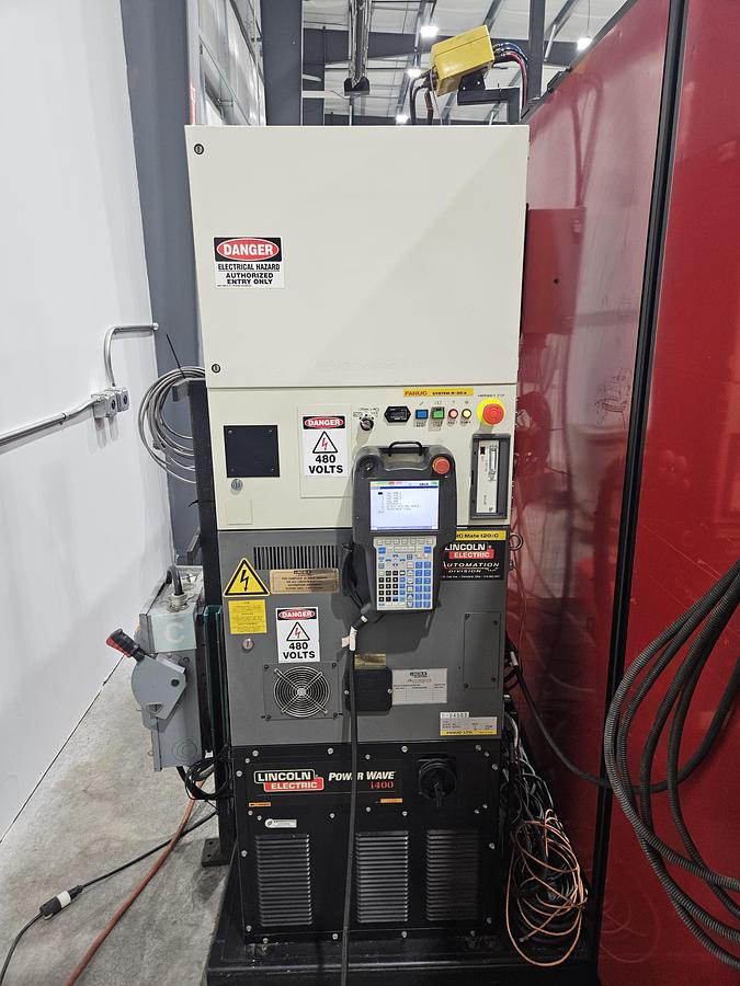 Used Lincoln system 35 weld cell Fanuc 120iC/10L with dual headstock positioners