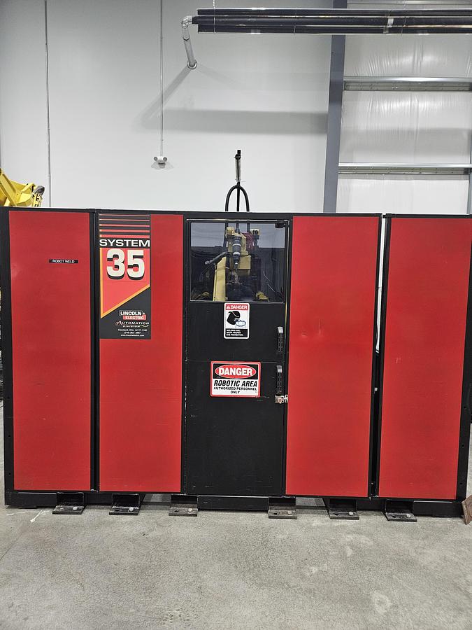 Used Lincoln system 35 weld cell Fanuc 120iC/10L with dual headstock positioners