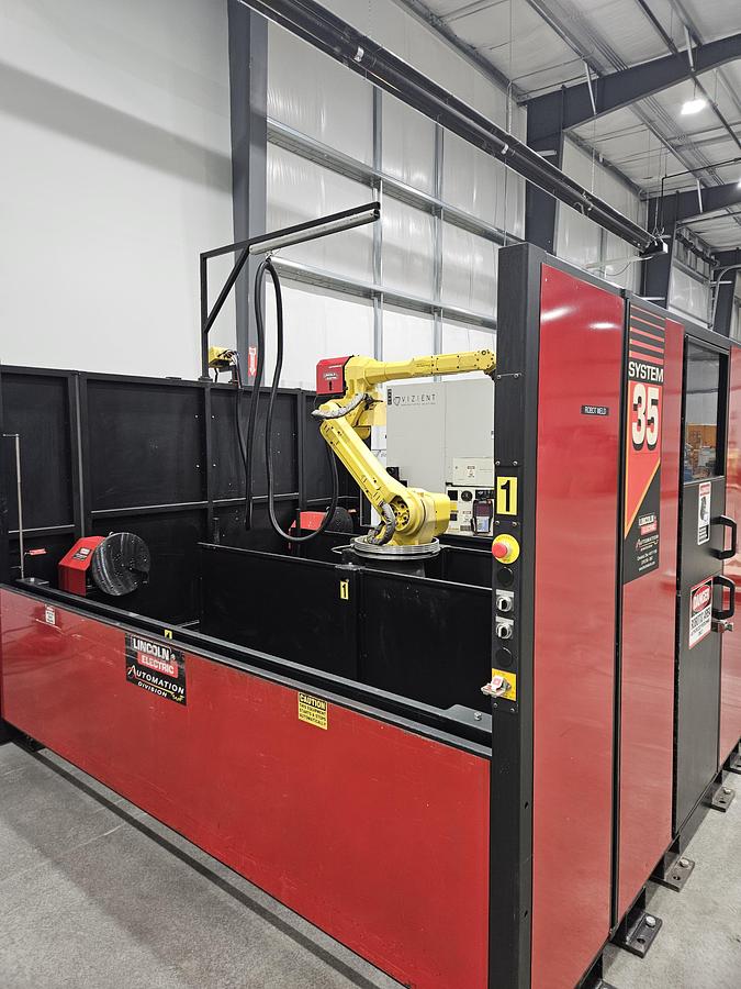 Used Lincoln system 35 weld cell Fanuc 120iC/10L with dual headstock positioners 