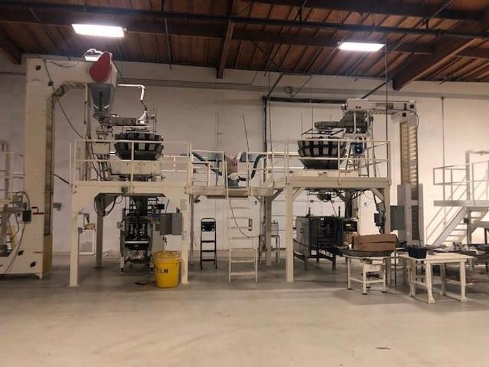 Used TWO COMPLETE VERTICAL FORM FILL & SEAL BAGGING LINES (Line #1) Hayssen Ultima VFFS Machine -16 Station ISHIDA ( Line #2) Woodman Polaris Roll-Stock Bagger/ 14 Station ISHIDA