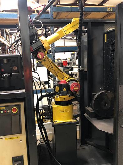 Used FANUC ARCMATE 100iB MIG WELDING CELL WITH A/B SIDED INDEX TABLE AND 7TH AXIS SERVO HEADSTOCK RJ3iB