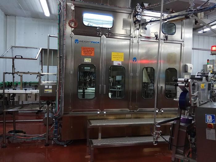 Used WEIGHTPACK BOTTLE FILLING MACHINE WITH FOIL CAP