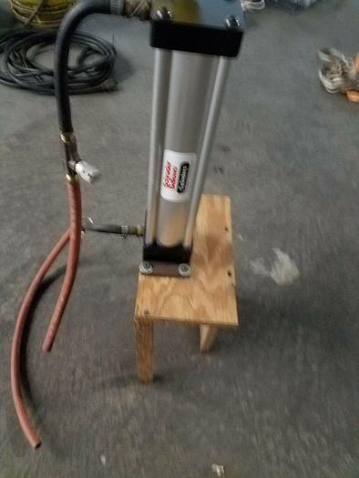 Used Schrader Bellows Eco Ram II Cylinder mounted on platform