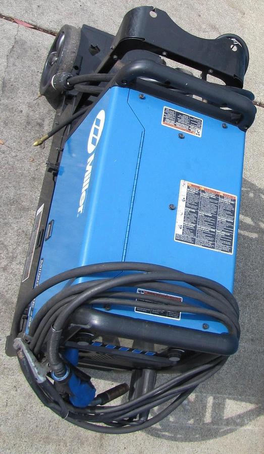 Used Miller Millermatic 255 MIG Pulsed MIG Welder 230V 3 Phase 7in LCD Cart Helmet