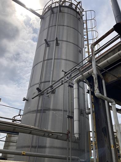 Used Used Wolfe Mechanical 20,000 gallon 304 stainless steel vertical storage tank. 