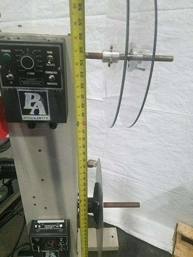 Used PA Industries Double Coil Motorized Stock Reel with Paper Interleaf Payoff Feed