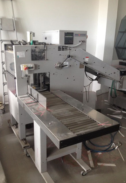 Used Rima RS 1012 S compensating stacker with discharge roller table