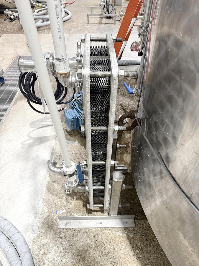 Used Used 2650 Gallon Jacketed Tank, 304 Stainless Steel, With Heat Exchanger & Pump