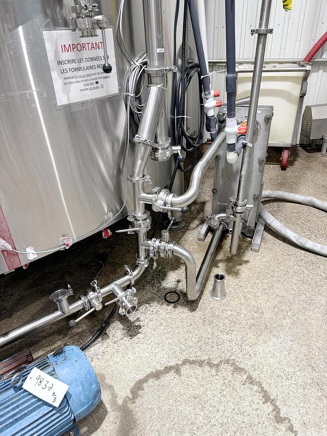 Used Used 13,208 Gallon Tank, 304 Stainless Steel, With Heat Exchanger & Pump
