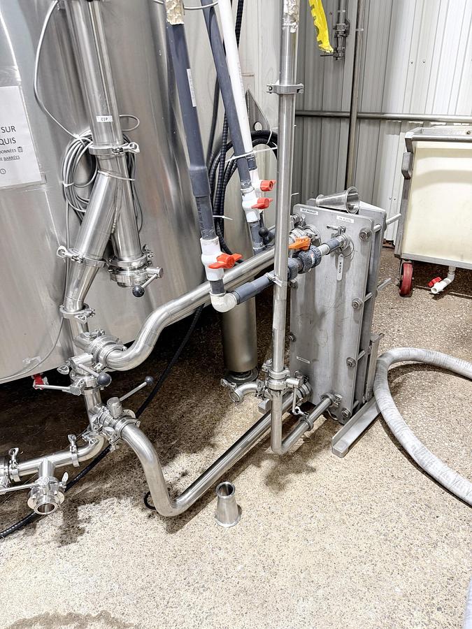 Used Used 13,208 Gallon Tank, 304 Stainless Steel, With Heat Exchanger & Pump