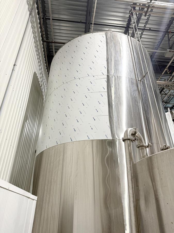 Used Used 13,208 Gallon Tank, 304 Stainless Steel, With Heat Exchanger & Pump