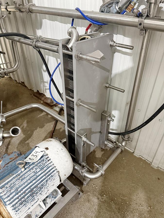 Used Used 13,208 Gallon Tank, 304 Stainless Steel, With Heat Exchanger & Pump