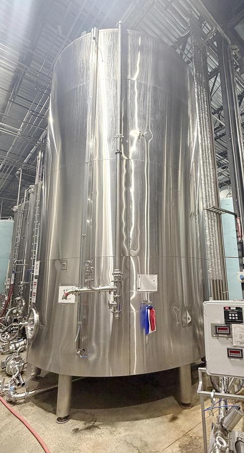 Used Used 13,208 Gallon Tank, 304 Stainless Steel, With Heat Exchanger & Pump