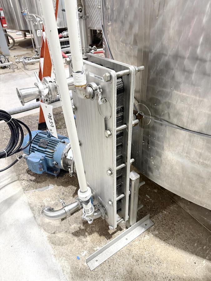 Used Used 2650 Gallon Jacketed Tank, 304 Stainless Steel, With Heat Exchanger & Pump