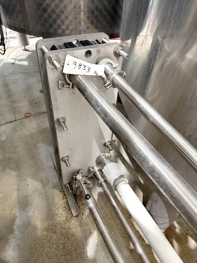 Used Used 13,208 Gallon Tank, 304 Stainless Steel, With Heat Exchanger & Pump