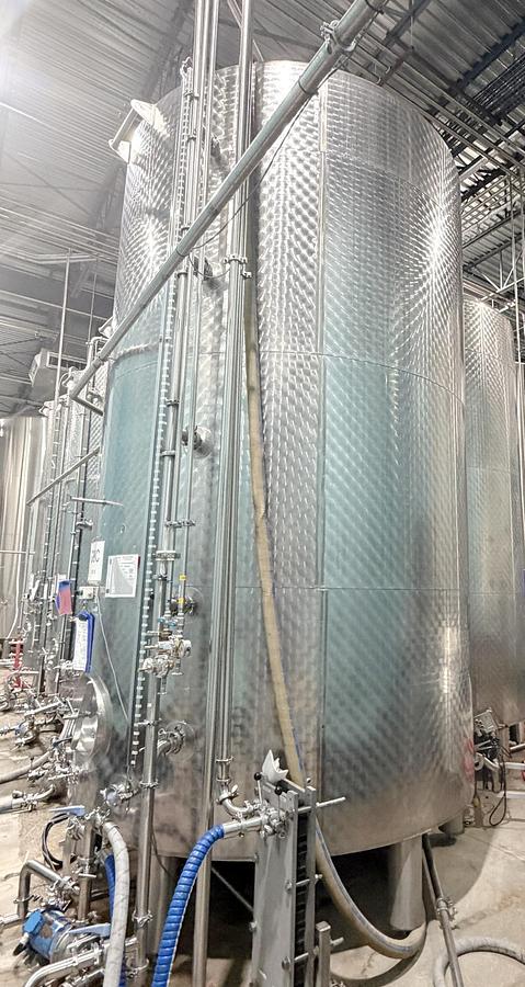 Used Used 5000 Gallon Tank, 304 Stainless Steel, With Heat Exchanger & Pump